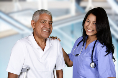 nurse and senior man smiling